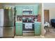 Functional kitchen featuring stainless steel appliances and ample storage space at 736 Flamingo Dr, Apollo Beach, FL 33572