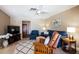 Inviting living room with stylish furniture, a ceiling fan, a neutral color palette and warm natural light at 736 Flamingo Dr, Apollo Beach, FL 33572
