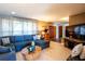 Spacious living room with a comfortable blue sectional sofa and stylish decor at 736 Flamingo Dr, Apollo Beach, FL 33572