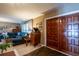 Living room featuring wood doors and a cozy seating area with a large sectional sofa at 736 Flamingo Dr, Apollo Beach, FL 33572