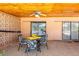 Relaxing screened patio featuring an outdoor table and chairs, great for dining and enjoying the outdoors at 736 Flamingo Dr, Apollo Beach, FL 33572