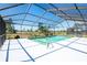 Beautiful screened-in pool with ample deck space for entertaining and relaxing on a sunny day at 736 Flamingo Dr, Apollo Beach, FL 33572
