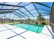 Inviting screened-in pool provides a private and relaxing retreat with clear blue skies above at 736 Flamingo Dr, Apollo Beach, FL 33572