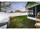 Fenced backyard with a screened in porch, and green lawn at 895 Sea Holly Dr, Brooksville, FL 34604