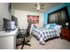 Bedroom with neutral carpet, ceiling fan, and large bed at 895 Sea Holly Dr, Brooksville, FL 34604