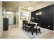 Inviting dining room with stylish decor, a modern light fixture, and a view into the adjacent kitchen at 895 Sea Holly Dr, Brooksville, FL 34604