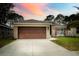 Charming single-story home with mature landscaping at 895 Sea Holly Dr, Brooksville, FL 34604