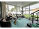 Screened-in patio furnished with seating and a ceiling fan at 895 Sea Holly Dr, Brooksville, FL 34604