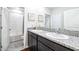Bathroom featuring double sinks with granite countertop and vanity at 9119 Forge Breeze Loop, Wesley Chapel, FL 33545