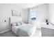Cozy bedroom with large window, neutral decor, and comfortable carpet flooring at 9119 Forge Breeze Loop, Wesley Chapel, FL 33545