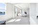 Bright bedroom with tray ceiling, carpet, with pond view at 9119 Forge Breeze Loop, Wesley Chapel, FL 33545