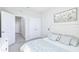 A cozy bedroom with soft carpet, floral decorations, white furnishings, and a serene atmosphere for relaxation and comfort at 9119 Forge Breeze Loop, Wesley Chapel, FL 33545