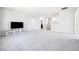 Expansive bonus room offering plush carpeting, plenty of natural light, and space for various activities at 9119 Forge Breeze Loop, Wesley Chapel, FL 33545