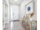 A stylish entryway showcasing decorative accents, a console table, and neutral tones at 9119 Forge Breeze Loop, Wesley Chapel, FL 33545