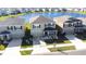 A beautiful exterior view of the house with a lake nearby at 9119 Forge Breeze Loop, Wesley Chapel, FL 33545