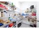 Walk-in pantry with organized shelves, displaying an assortment of food items and kitchen supplies, creating ample storage at 9119 Forge Breeze Loop, Wesley Chapel, FL 33545