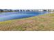 Peaceful backyard view of a serene pond, perfect for relaxation and enjoying nature at 9119 Forge Breeze Loop, Wesley Chapel, FL 33545