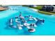 An amazing floating water obstacle course adds fun and excitement to this expansive community lagoon at 9119 Forge Breeze Loop, Wesley Chapel, FL 33545