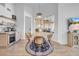 Dining area features a round wooden table with seating for four and a drink fridge at 9515 Silverthorn Rd, Seminole, FL 33777