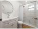 Modern bathroom with a walk in shower, a stylish vanity, and updated fixtures at 10113 Huntley St, New Port Richey, FL 34654