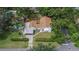 Aerial view of the home showcasing the backyard pool and lush surroundings at 11718 N Ola Ave, Tampa, FL 33612