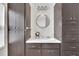 Bathroom with dark wood cabinets, vanity and lighting at 11718 N Ola Ave, Tampa, FL 33612