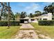 Single-story home with a driveway and carport at 11718 N Ola Ave, Tampa, FL 33612