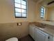 Small bathroom with a vanity, sink, and toilet at 130 80Th Ne Ave, St Petersburg, FL 33702