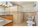 Modern bathroom featuring granite countertops, updated fixtures, walk-in shower, and bidet at 130 80Th Ne Ave, St Petersburg, FL 33702