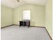 Neutral bedroom with carpet, light green walls, and vaulted ceiling at 130 80Th Ne Ave, St Petersburg, FL 33702