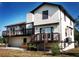 Rear exterior showcasing a spacious deck with wood railing and a backyard area at 130 80Th Ne Ave, St Petersburg, FL 33702