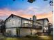 Rear view of the home with a deck, showcasing outdoor space and backyard at 130 80Th Ne Ave, St Petersburg, FL 33702