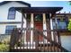 Charming home entrance with wood porch, decorative windows, and inviting curb appeal at 130 80Th Ne Ave, St Petersburg, FL 33702