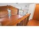 Spacious living room with wood paneling, hardwood floors, and ample natural light at 130 80Th Ne Ave, St Petersburg, FL 33702