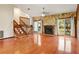 Expansive living room with beautiful fireplace and sliding door access to the outdoor deck at 130 80Th Ne Ave, St Petersburg, FL 33702