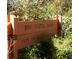A wooden sign displays the name 