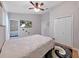 Bright bedroom featuring a ceiling fan, television, and mirrored closet at 13012 Creek Manor Ct, Riverview, FL 33569