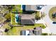 Overhead view of a house with a pool, patio area, and well-maintained landscaping at 1307 Garden Stone Ln, Brandon, FL 33510