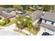 Overhead shot of a home in a residential area with a long driveway and mature trees surrounding the property at 1307 Garden Stone Ln, Brandon, FL 33510
