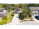 Aerial view of a well-maintained home with a spacious driveway and lush landscaping in a peaceful neighborhood at 1307 Garden Stone Ln, Brandon, FL 33510