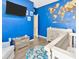 Nautical-themed Bedroom with blue walls, a charming crib, and a decorative world map for an adventurous touch at 1307 Garden Stone Ln, Brandon, FL 33510