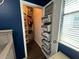 Walk-in closet with custom shelving and storage solutions, optimizing space and organization at 1307 Garden Stone Ln, Brandon, FL 33510