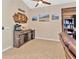 Living room featuring modern furniture with a wood accent wall and tile flooring at 1307 Garden Stone Ln, Brandon, FL 33510