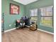 Functional office space with hardwood floors, natural light, and a desk setup ready for productivity at 1307 Garden Stone Ln, Brandon, FL 33510