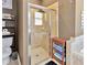 Stylish bathroom featuring a glass enclosed shower and coordinated towel storage at 1307 Garden Stone Ln, Brandon, FL 33510