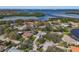 Aerial view of home nestled in a lush neighborhood, showcasing its proximity to the river at 1426 75Th Ne Cir, St Petersburg, FL 33702