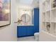 Stylish bathroom featuring custom blue cabinets and modern fixtures at 1426 75Th Ne Cir, St Petersburg, FL 33702