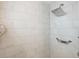 This shower boasts stylish marble tile, a rainfall showerhead, and a convenient grab bar for added safety at 1426 75Th Ne Cir, St Petersburg, FL 33702
