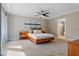 Calm bedroom with plush carpet, fan and ensuite bathroom at 1426 75Th Ne Cir, St Petersburg, FL 33702