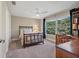 Cozy bedroom with a comfortable bed, natural light, and a built-in bookcase for a tranquil retreat at 1426 75Th Ne Cir, St Petersburg, FL 33702
